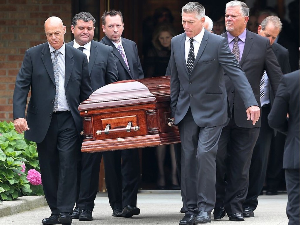 Pallbearers carry the casket of Mark Boscariol after funeral services at Our Lady Of Mount Carmel Church in Windsor on Aug. 1, 2018. PHOTO BY DAN JANISSE /Windsor Star